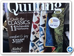 Chrity's quilt on the cover of Love of Quilting magazine