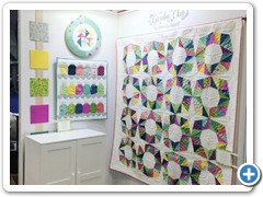 My quilt on the right hanging at market